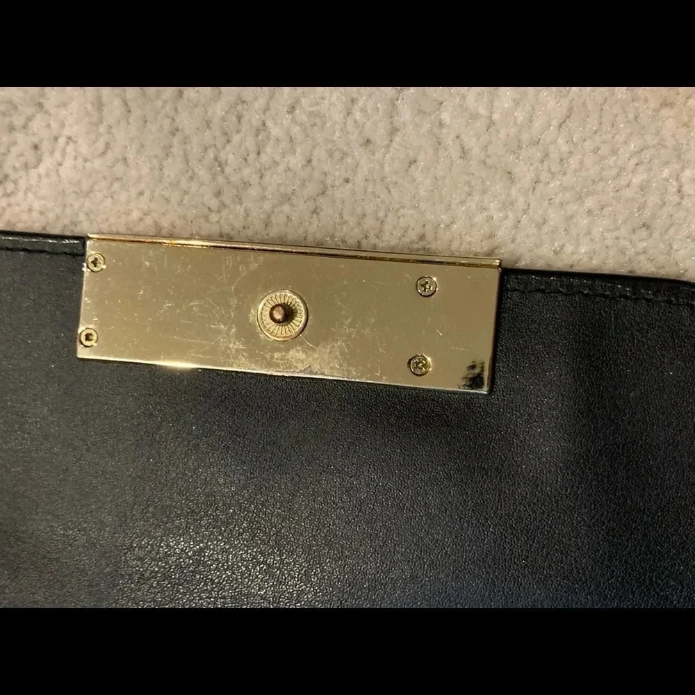VICTORIA’S Secret shimmer phone wallet, golden